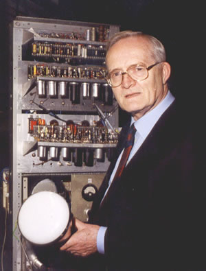 Tom Kilburn holding a Cathode Ray Tube in front of the Rebuild